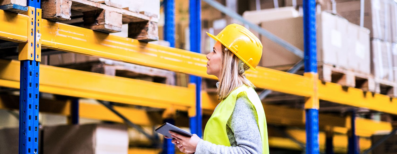 Woman warehouse worker with tablet